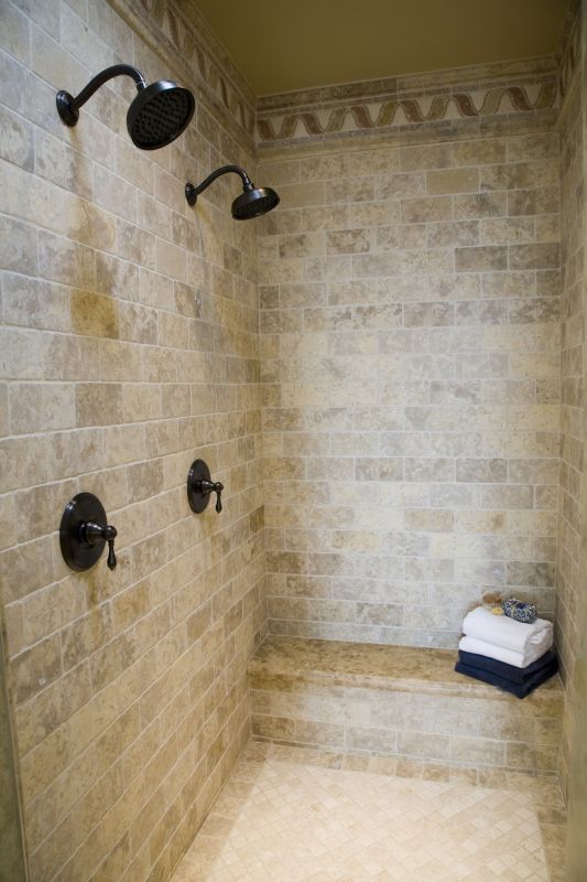 Double Shower Heads in a Spacious Enclosure